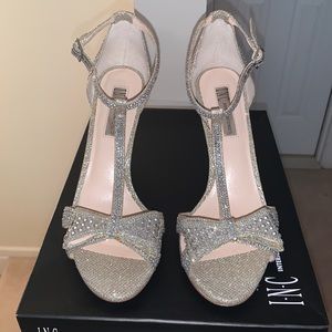 Inc. stiletto heeled sandal, rhinestone embellished.